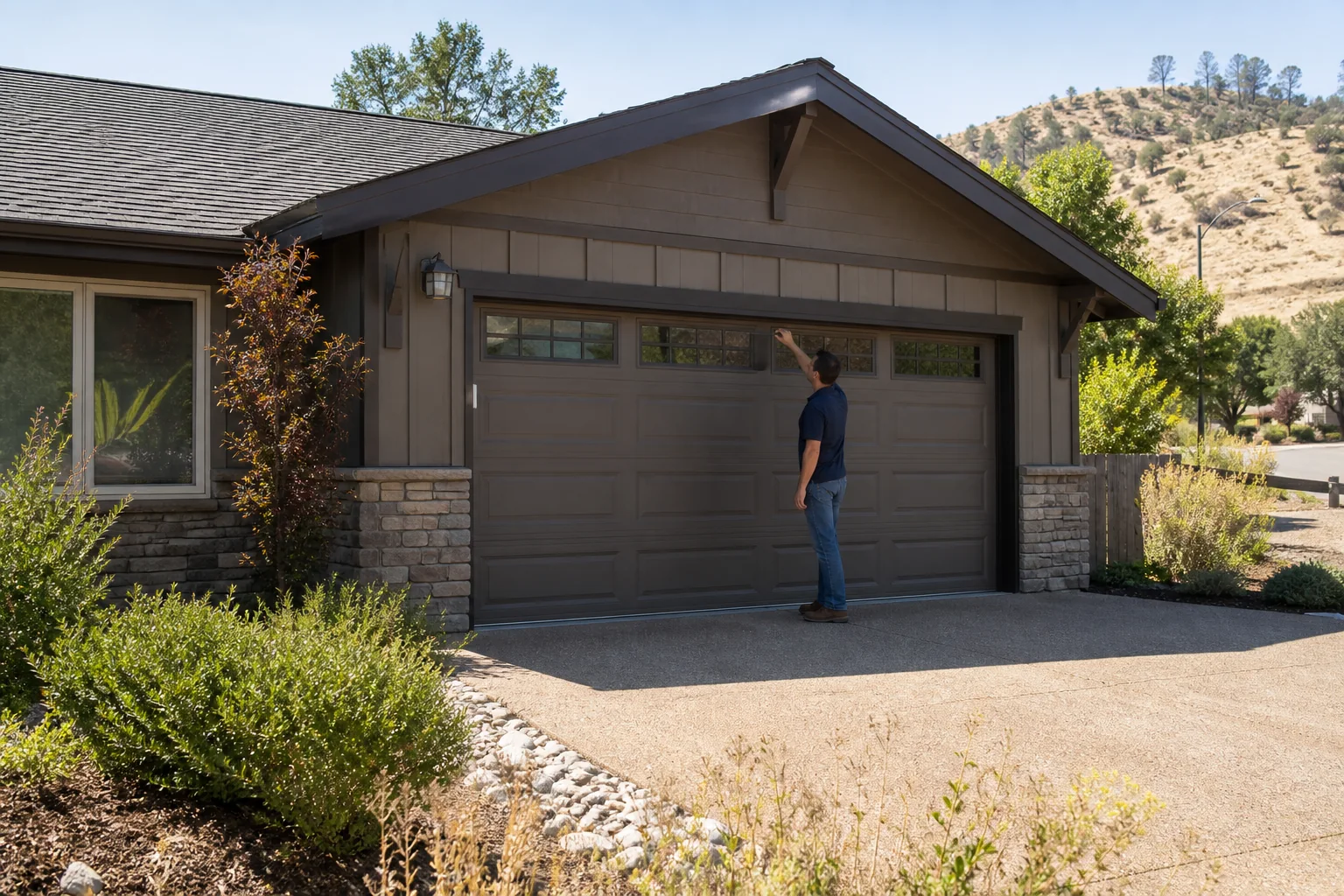 Garage door technician at a representative home in Medford, OR